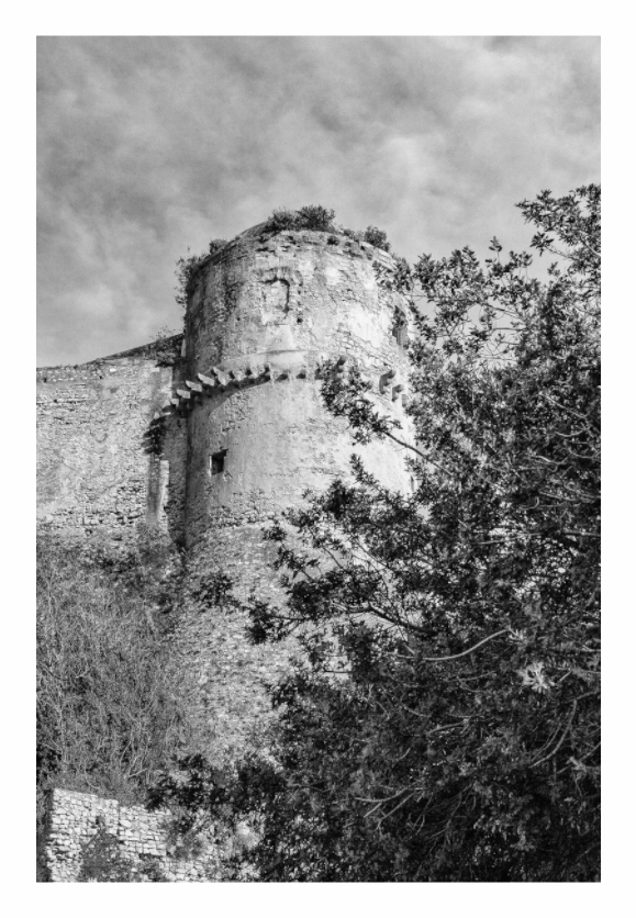 Tower in Abruzzo print, 80 × 120 cm with white border — ruined stone tower among trees, black and white Italian rural architecture photography by Tom Parsons