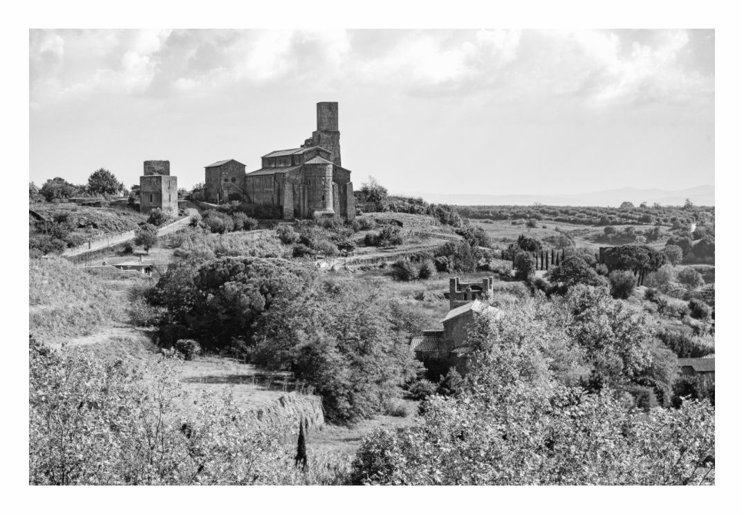 San Pietro print, 120 × 80 cm with white border — San Pietro basilica standing on its hilltop Etruscan acropolis, Tuscania, Lazio, black and white landscape photography by Tom Parsons