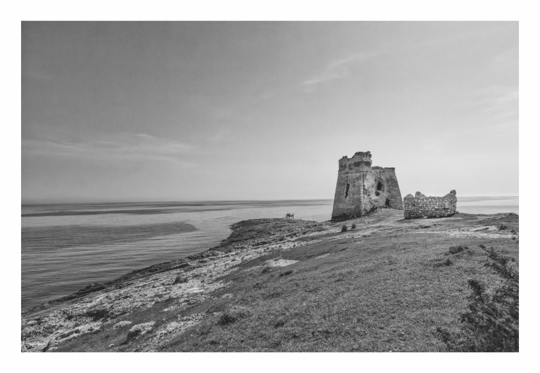 Fortification print, 120 × 80 cm with white border — ruined coastal watchtower on a rocky headland at dusk, Puglia, Italy, black and white landscape photography by Tom Parsons