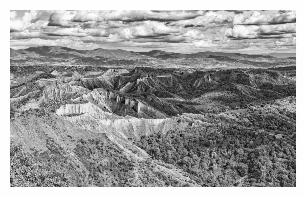 Valle dei Calanchi print, 145.3 × 90 cm with white border — eroded clay badlands of the Valle dei Calanchi, Lazio, Italy, black and white landscape photography by Tom Parsons