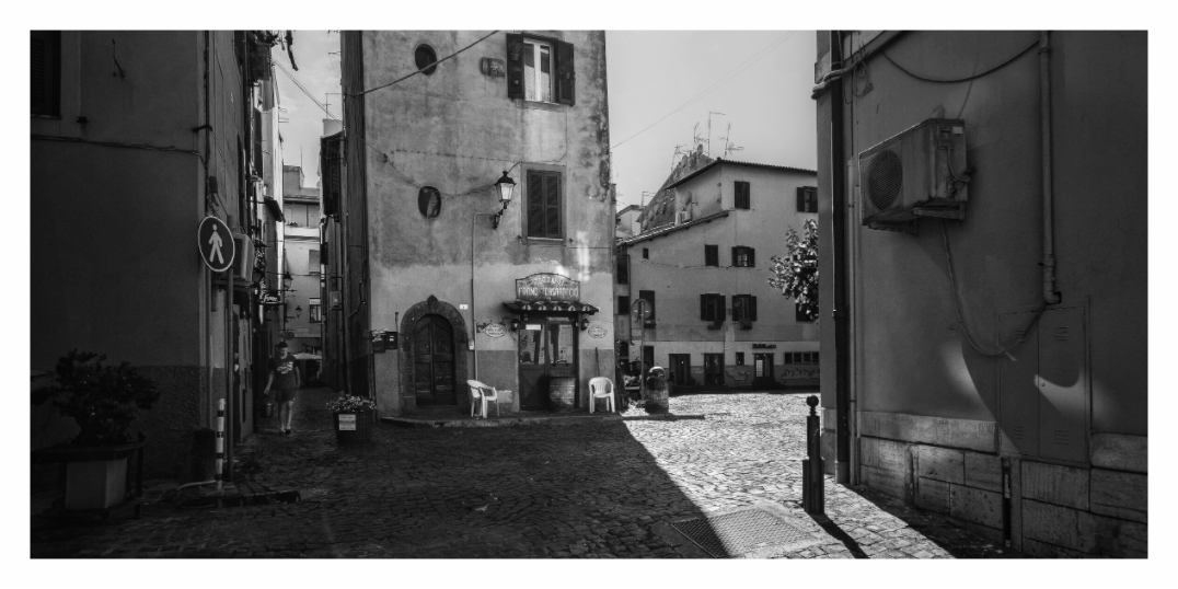Street scene, Sleepy Town print, 190.3 × 90 cm with white border — quiet Italian village cobblestone street, Lazio, black and white street photography by Tom Parsons