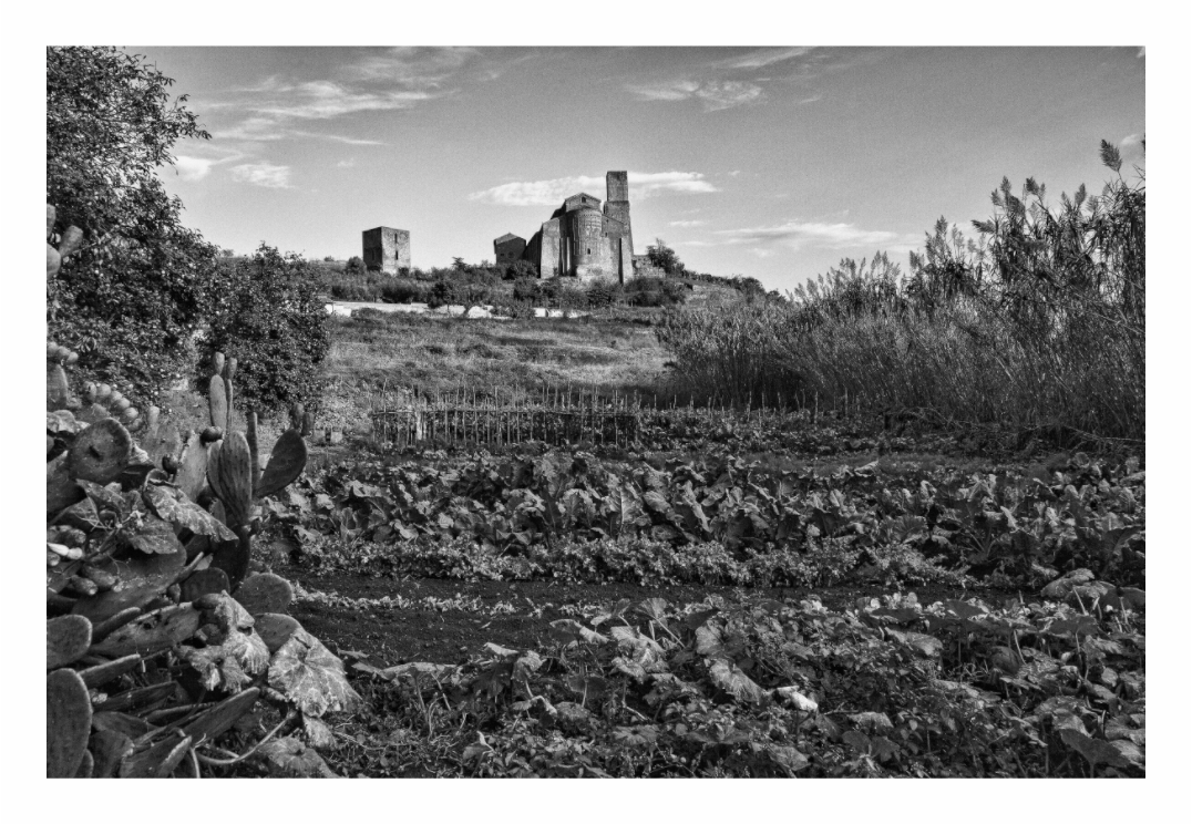 Santa Maria Maggiore print, 120 × 80 cm with white border — the church seen across cultivated fields on the ancient Etruscan acropolis, Tuscania, Lazio, black and white architectural photography by Tom Parsons
