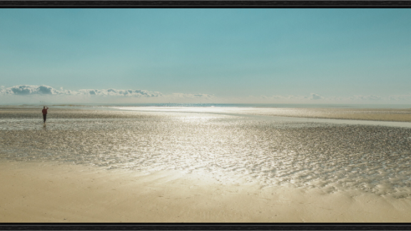 Camber Sands print, 209.5 × 60 cm panoramic — lone figure on the tideline at Camber Sands, East Sussex, colour beach landscape photography by Tom Parsons