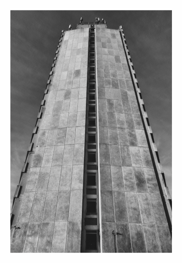 Arlington House print, 80 × 120 cm with white border — brutalist tower block viewed from directly below, Margate, black and white architectural photography by Tom Parsons