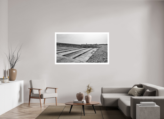 Lone Man on Steps black and white print, framed on a wall in a modern living room, by Tom Parsons